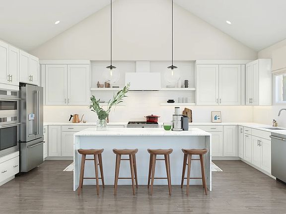 Kitchen with vaulted ceiling and pendant lighting