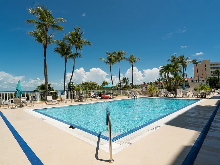 Resident amenities: waterfront pool, marina & sunset views