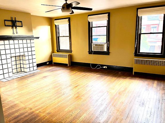 Large front room with lots of natural light