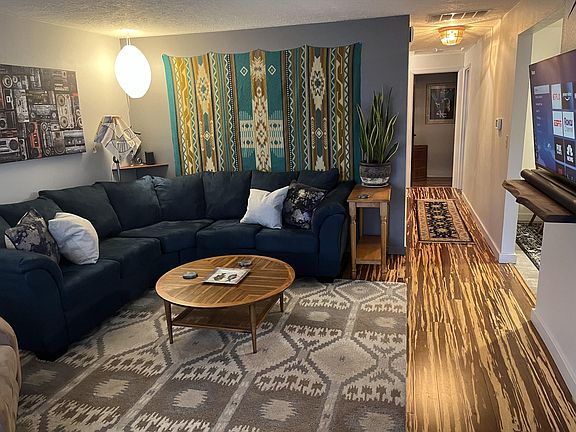 living and hallway to bedrooms and bathrooms, plus full-size linen closet in hallway