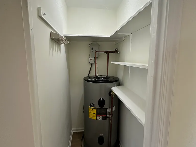 Large utility room, features additional storage. Great to use for Costco purchases, coolers, strollers, etc.