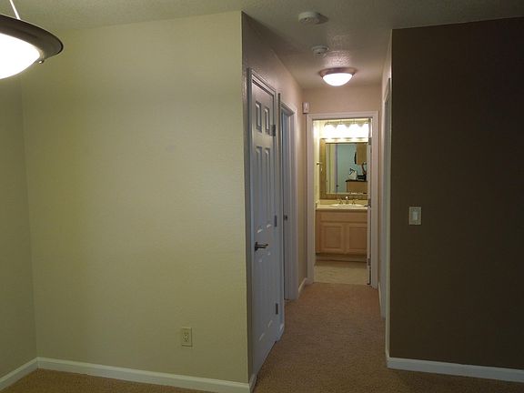 Coat closet, laundry room on the left. Bedroom on the right. Bathroom straight ahead.
