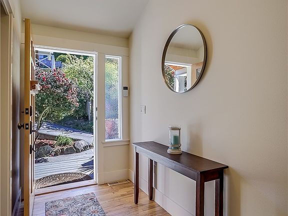 Warm Hardwood floors at entrance and throughout the Home.