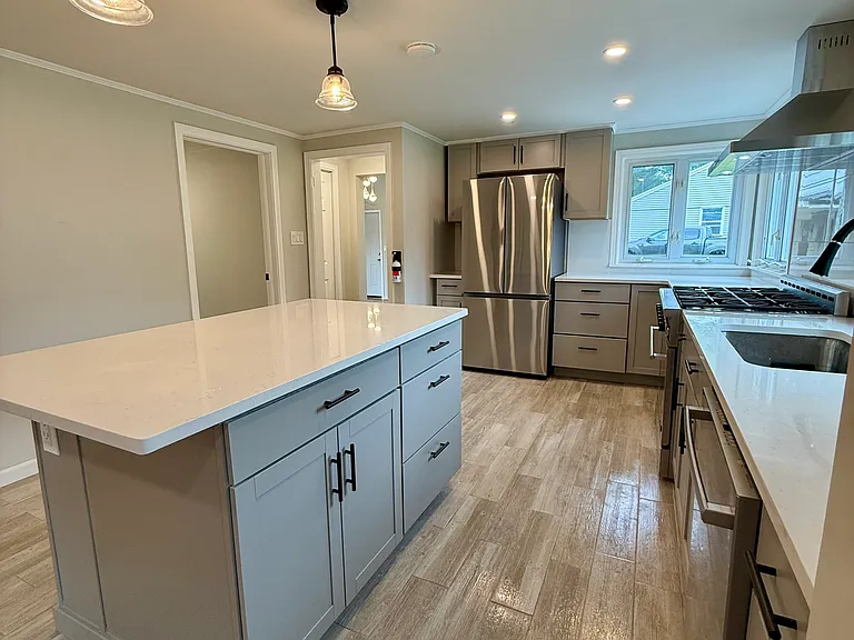 modern open concept kitchen with brand new appliances and Bosch dishwasher