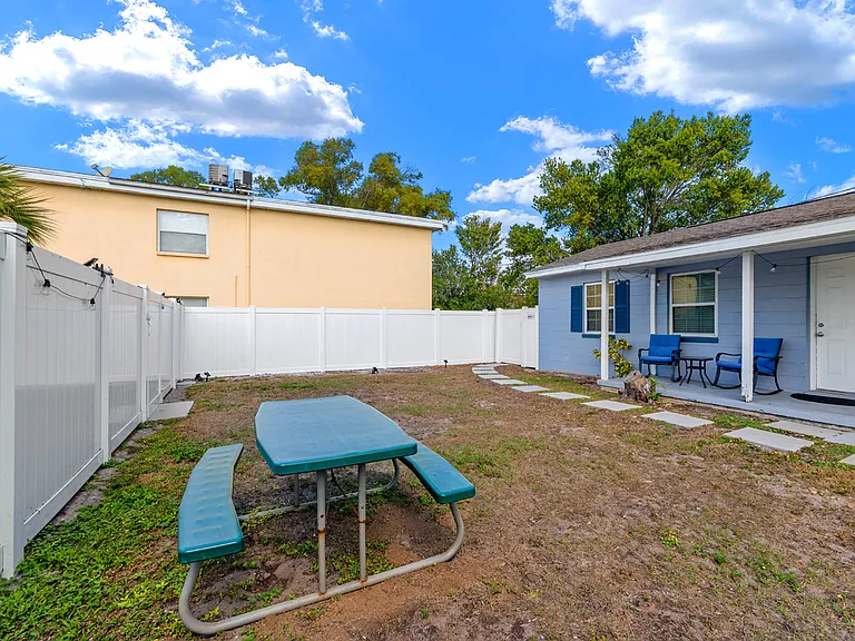 Front porch with porch chairs/table included to enjoy the fenced in backyard