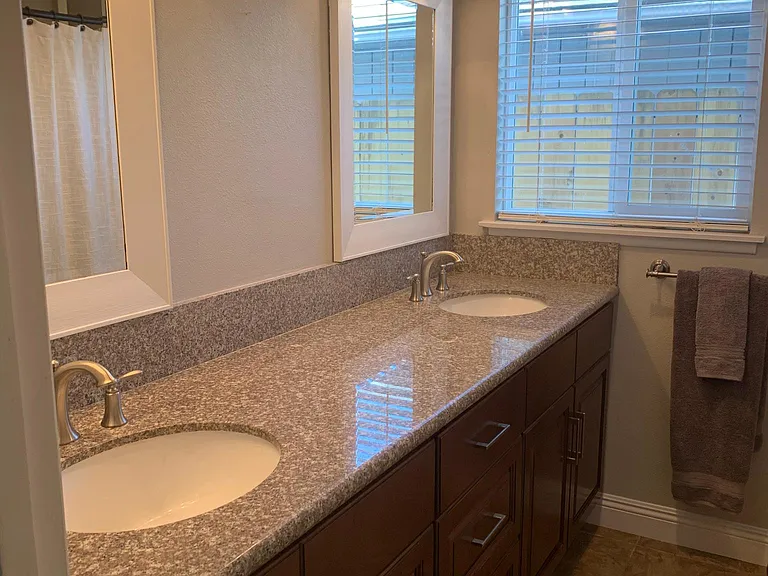 Bathroom with dual sinks. Full size cabinets and drawers with great storage.