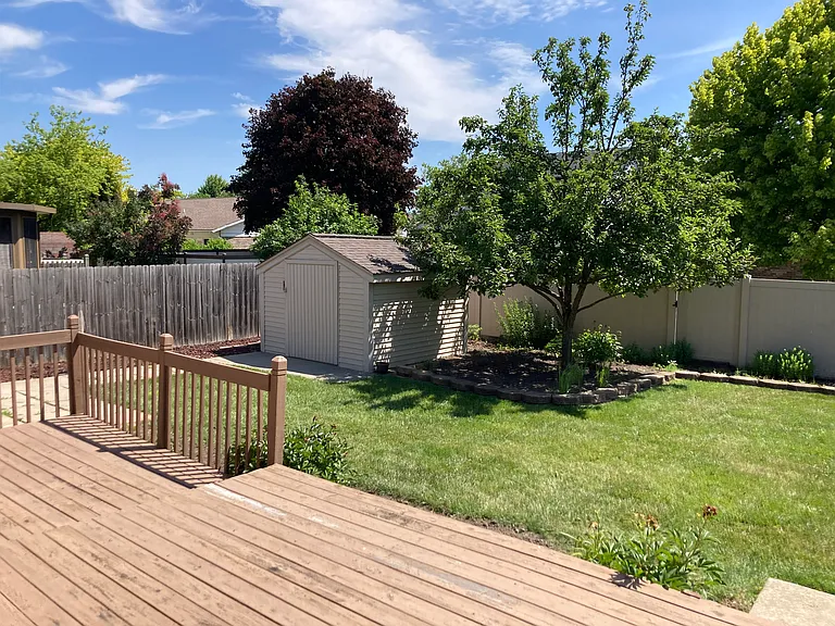 deck overlooking spacious backyard