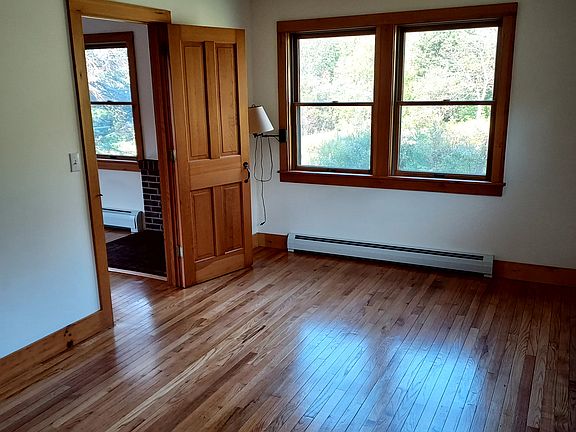 View of bedroom. Has 4 half-sized windows on right side wall as well (not shown in photo).