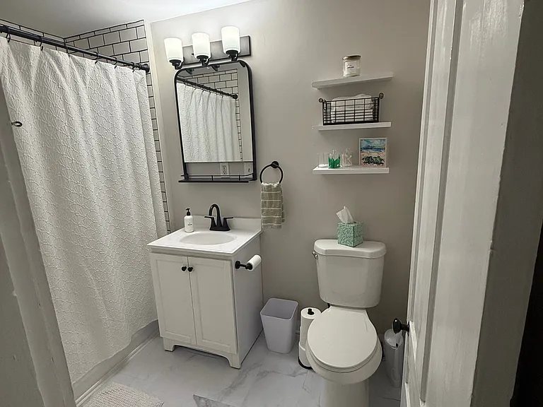 Full bathroom--new floor, toilet, mirror/vanity and bathroom exhaust fan just added