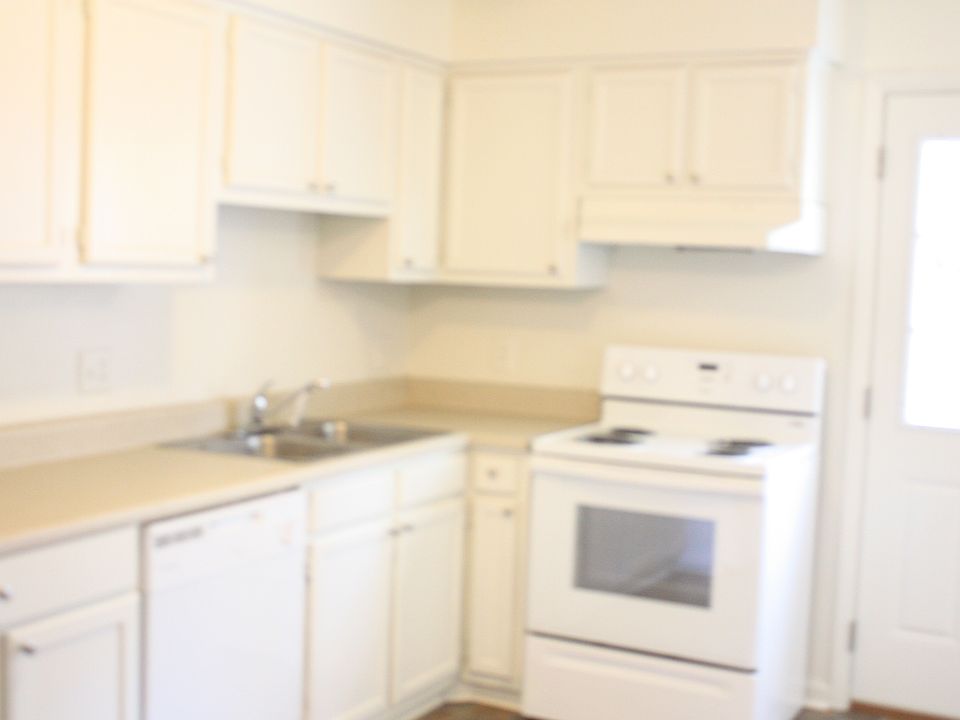 light filled kitchen with new appliances and counters
