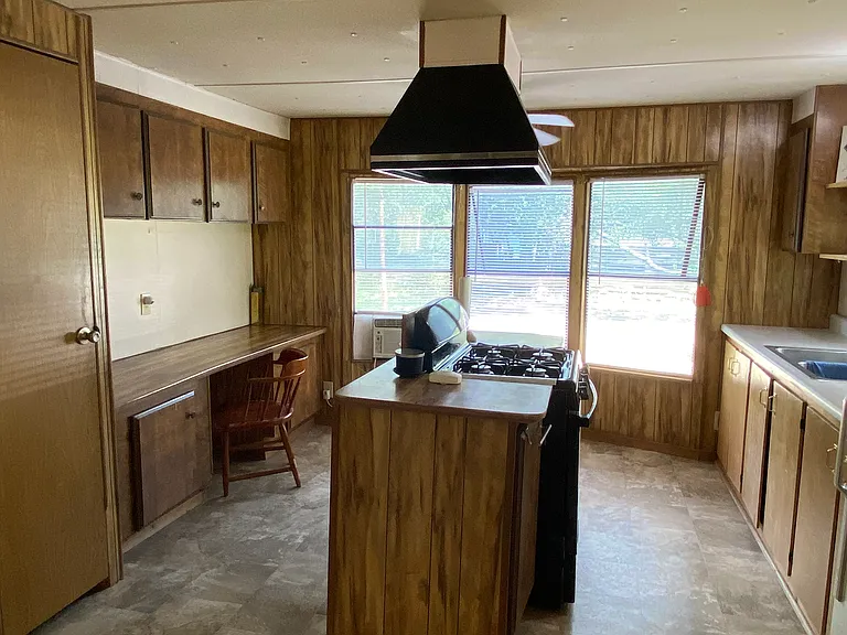 Kitchen has bay windows, a breakfast nook and a separate pantry.