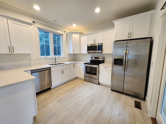 Kitchen with Stainless steel appliances including dishwasher