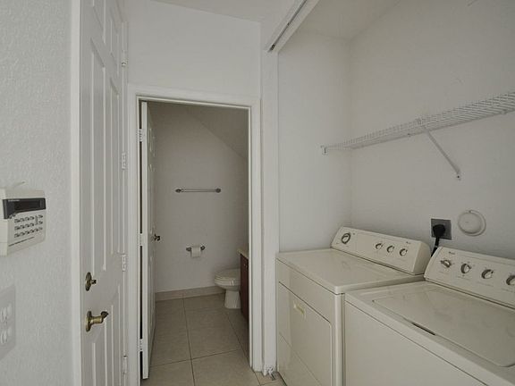 Hallway from Living Room to Half Bath & Utility Closet