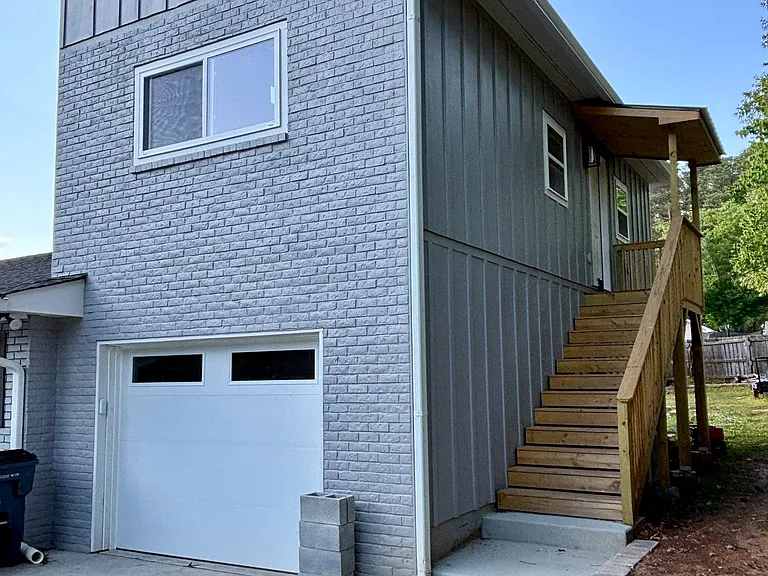 Private entry with dedicated parking spot in front.