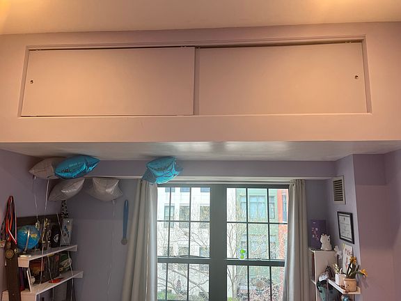 Additional overhead storage in secondary bedroom