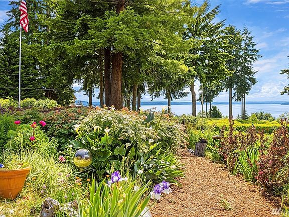 Fantastic views over the grounds and gardens to sound and mountain. When it's clear, Mt. Rainier surveys the sound through the evergreens in the distance. The viewing site across 87th is on the property.