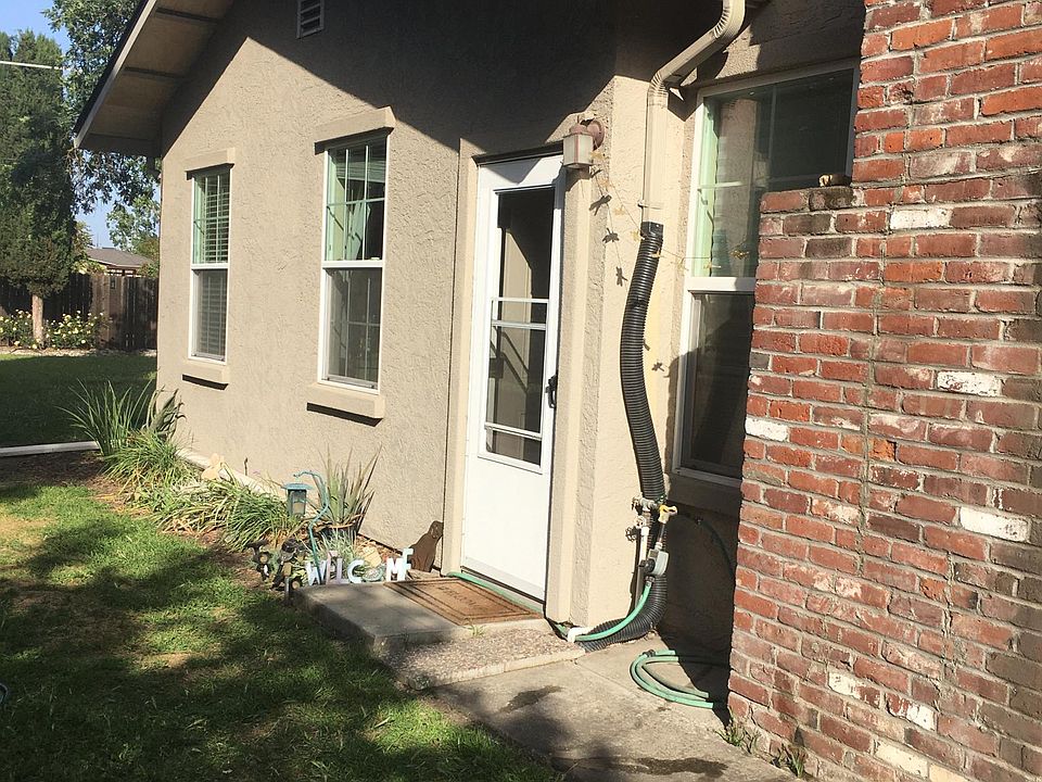 Entrance from gated side yard. Parking is off street beside the gate.