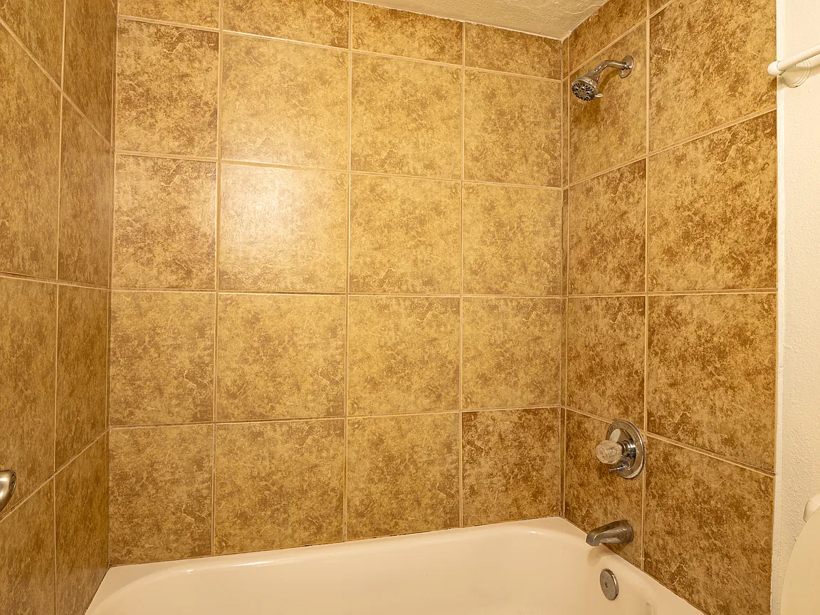 Apartment bathroom — representative home at Fairway Vistas Condominiums.