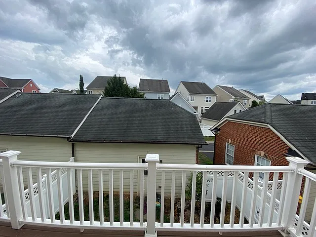 Detached 2-car garage and courtyard below the balcony