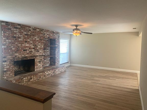 Great room with built in shelves. New luxury vinyl plank floors extending thru hallway and including master bedroom