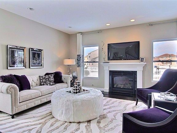 SPACIOUS GREAT ROOM SHOWS CAN LIGHTS AND FIREPLACE NOT INCLUDED IN BASE PRICE