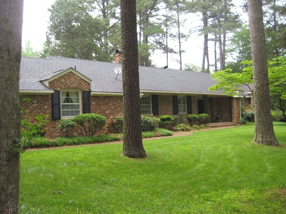 Serene setting for this brick ranch