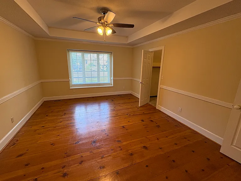 Primary bedroom with walk-in closet