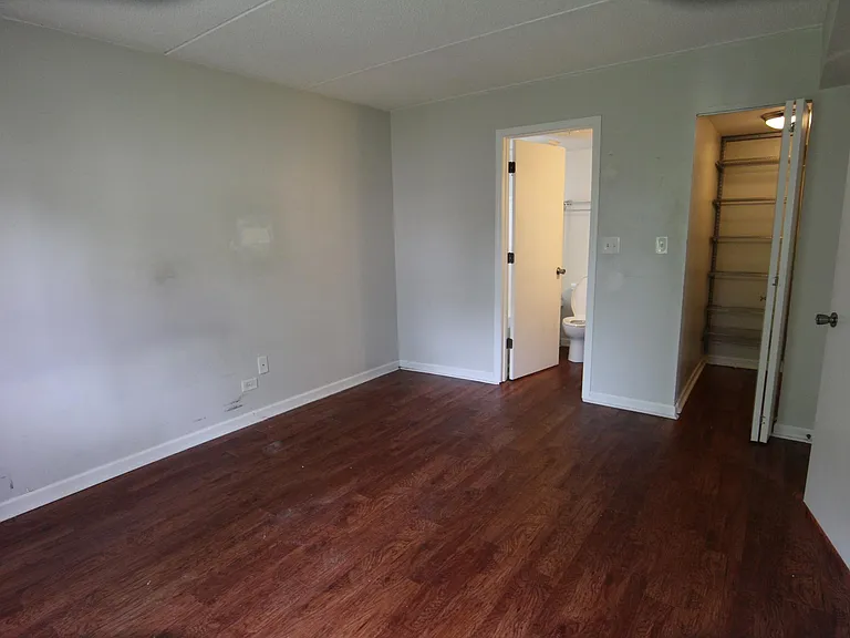 Bedroom from window. Wood look vinyl flooring.