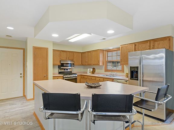 Notice the wide bar for putting groceries on when coming home and there is a pantry for storing thos