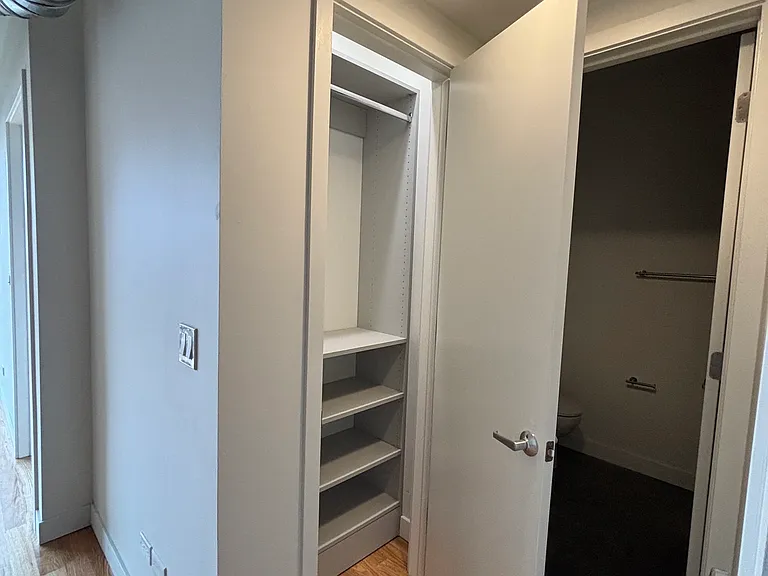 Coat closet in main living space off kitchen area