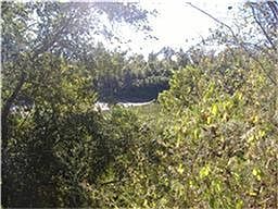 River in back yard of property . Subdivision fishing and swimming