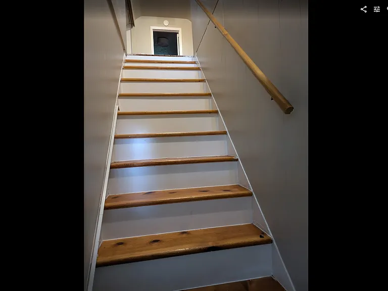Stairs to upstairs bedroom and bonus space