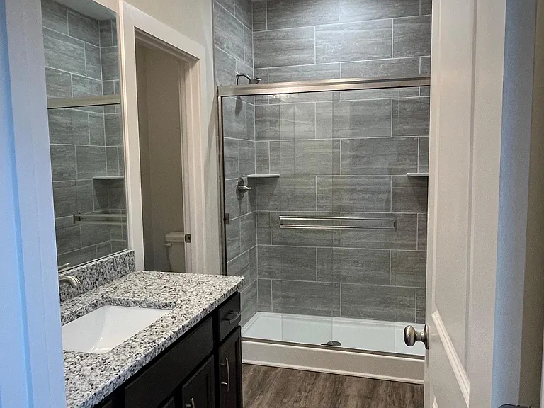 Primary bath (ensuite). Includes a separate water closet. Floor to ceiling tile in shower.