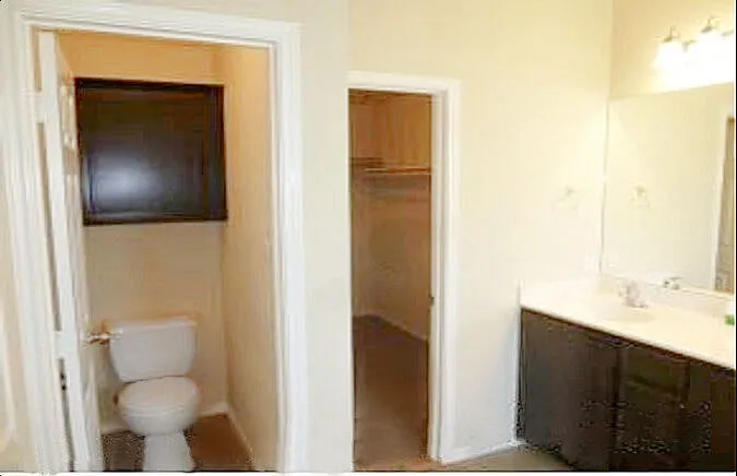 Master bath dbl sinks, toilet room & walk-in closet.