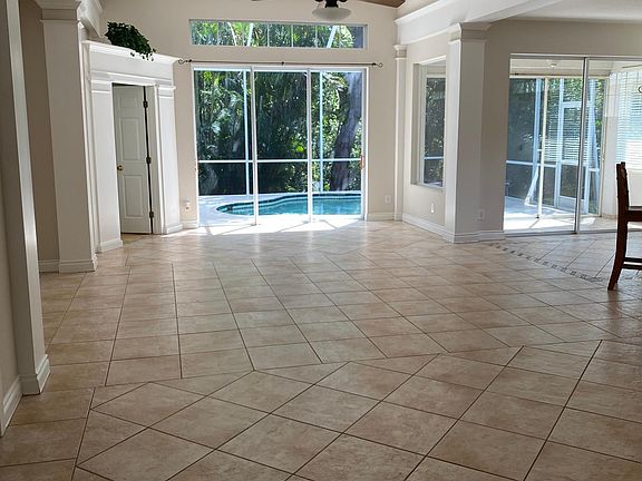 large living room looking over the pool and preserve