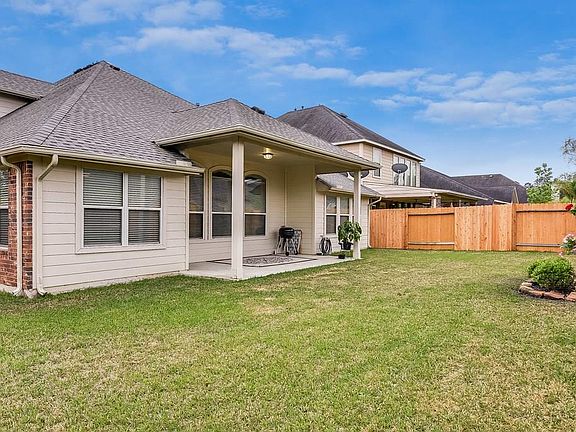 Backyard entertainment is encouraged here with the large covered patio and new fence. The roof is one year old, and the A/C, all ready to move into.