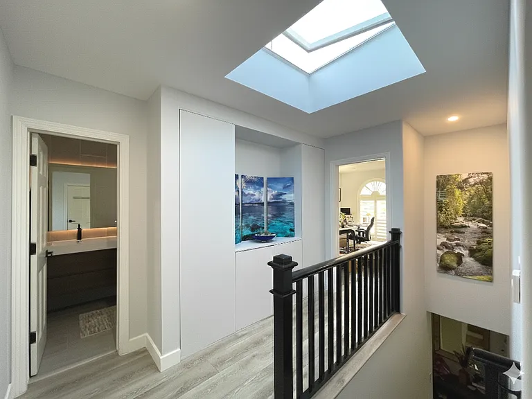 An airy upstairs hallway leads to all four bedrooms