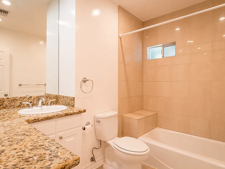 LARGE MAIN BATHROOM W/ NEW TILE W/ BENCH, GRANITE COUNTERTOPS AND TONS OF COUNTER SPACE