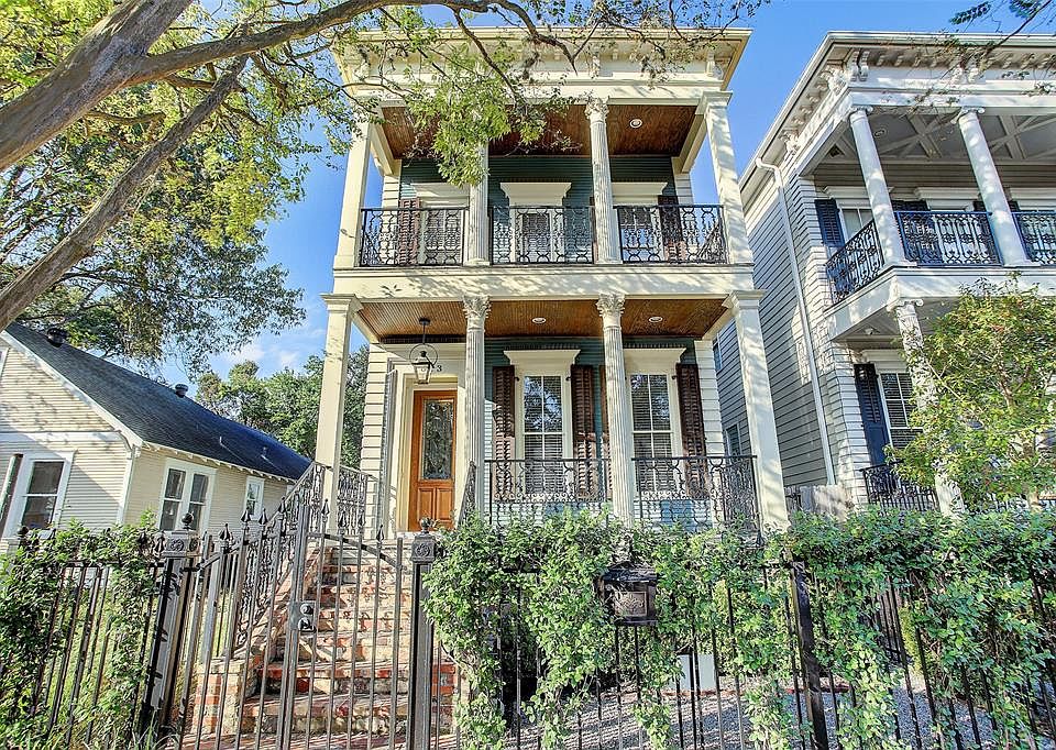 Stately New Orleans-style home in the heart of The Heights. Gorgeous porches front and back and off the primary suite. So many u