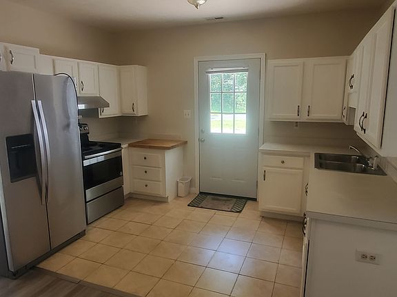 From the dining area looking into the kitchen.