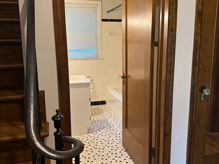First floor full bathroom adjacent stairs