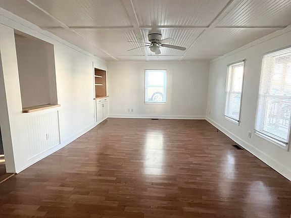View into Family Room. Includes pass-thru and storage cabinets with LED colored lighting! Great for games, books or a turntable.