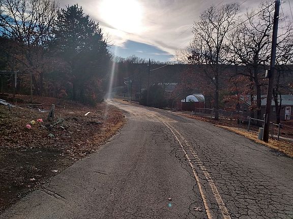 Paved road in front of home 