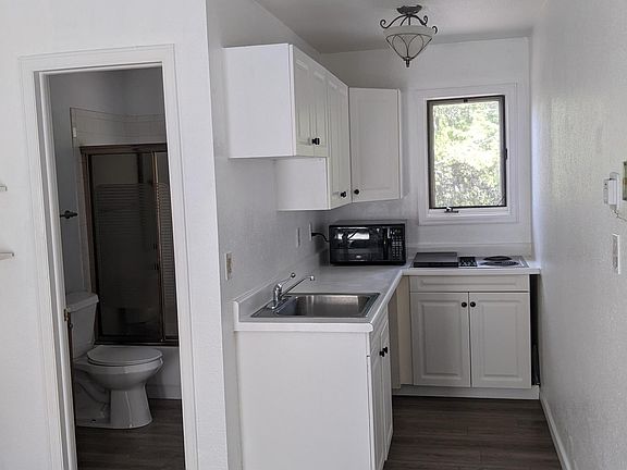 Kitchen-Room for Mini-fridge, or use garage fridge.