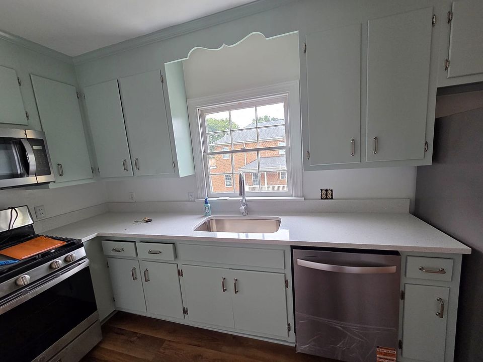 Newly renovated kitchen with new countertop and appliances.