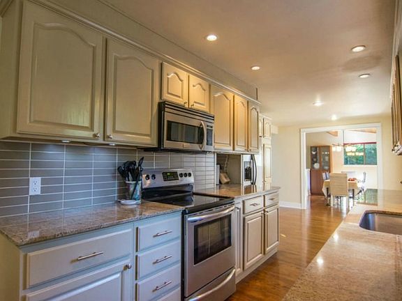 Custom back splash, plenty of countertop space and tons of cabinet storage make this the perfect kitchen.