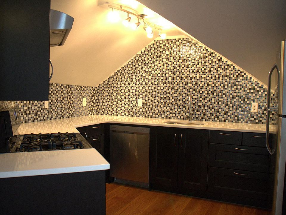 Kitchen with fridge, freezing with ice maker and modern equi