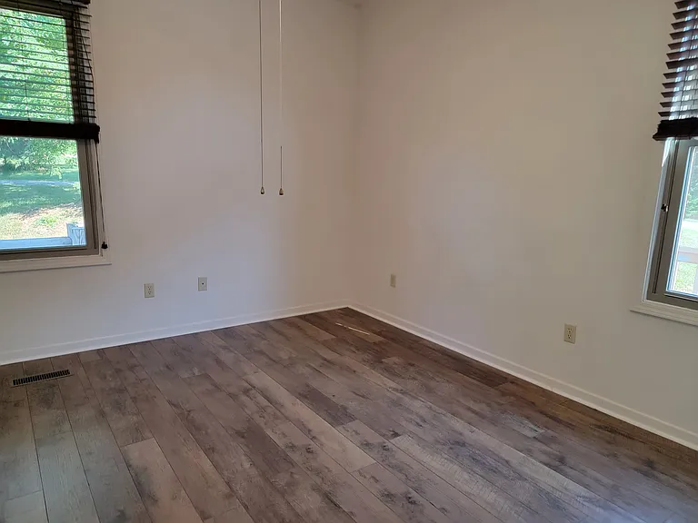 two windows in larger bedroom