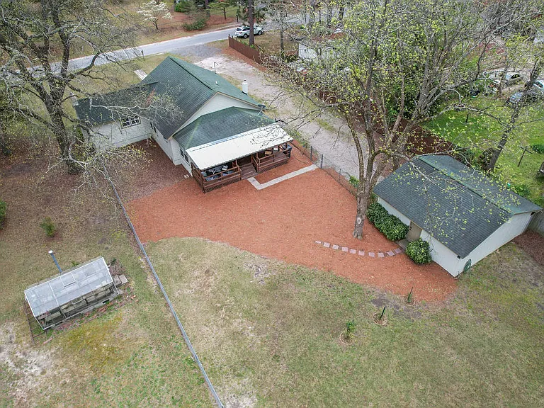 Imagine all the lawn games in this huge fenced in back yard!