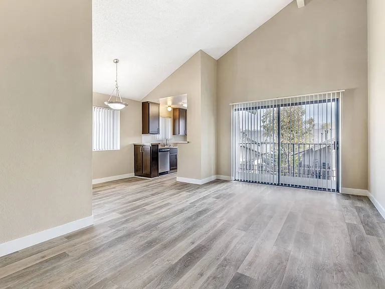 Step into serenity: Embrace the spacious living and dining areas, seamlessly connected to a private balcony at Independence Plaza. Your new home awaits, where relaxation meets modern luxury.